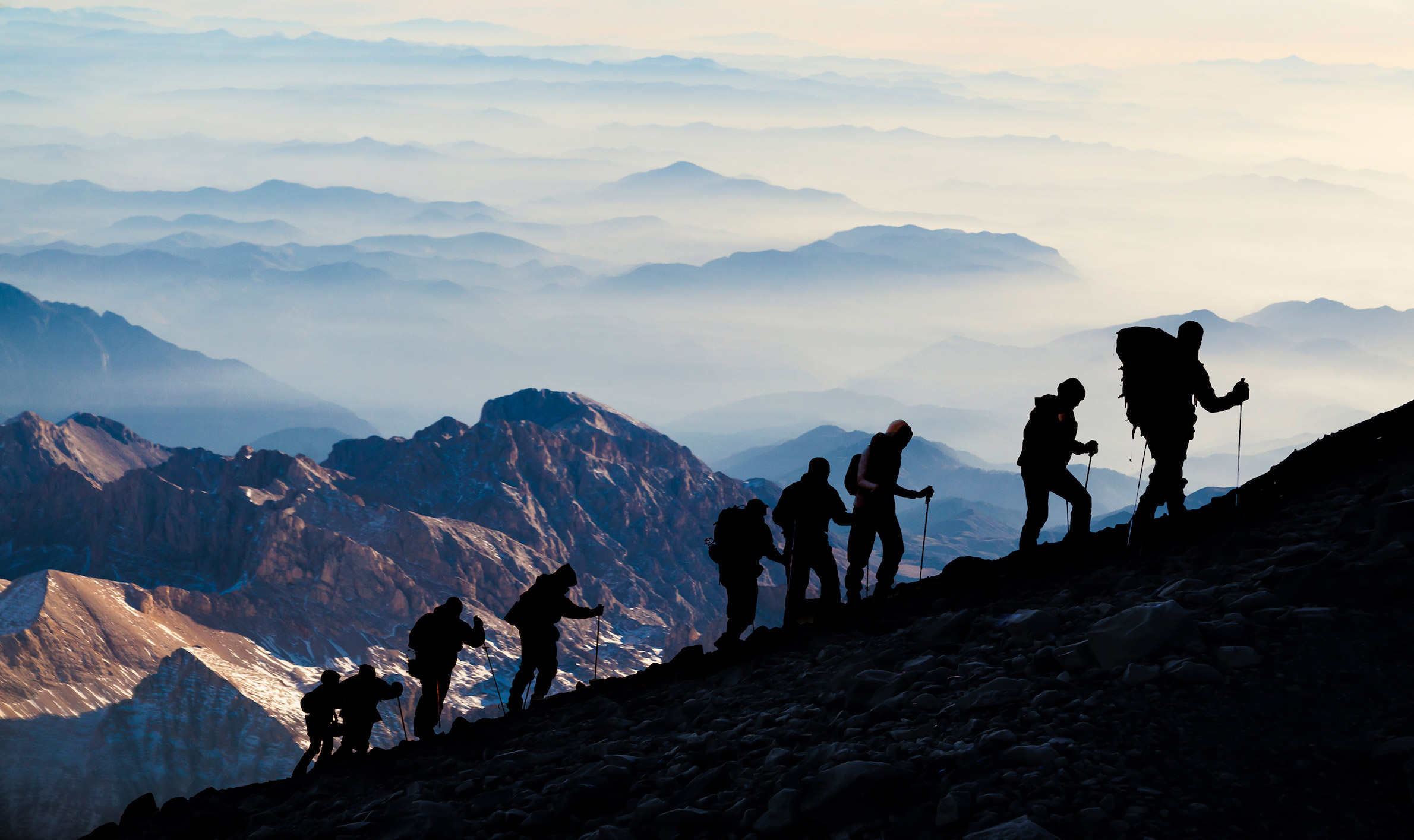 8 people hiking a mountain